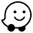 The Waze logo, a black and white speech bubble icon with a smiley face, on wheels.